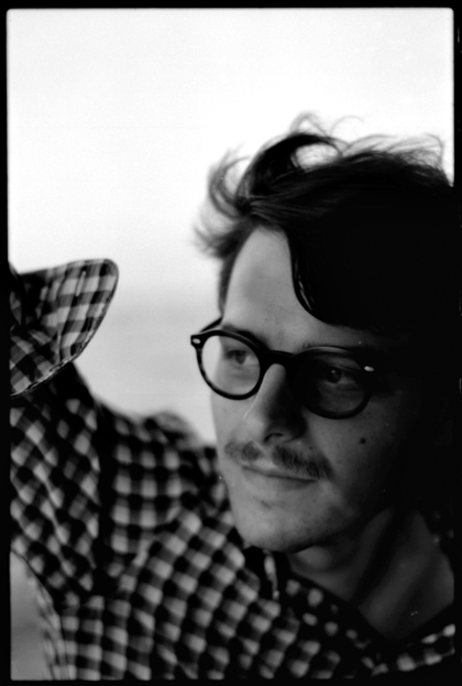 portrait of man with glasses black and white on film